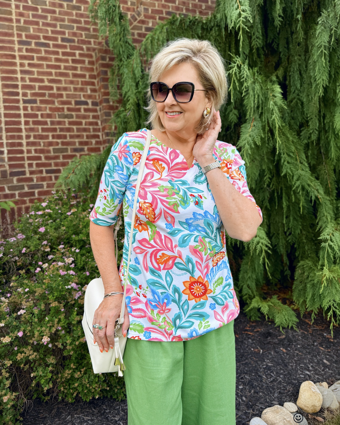 Tania Stephens wearing a colorful printed top